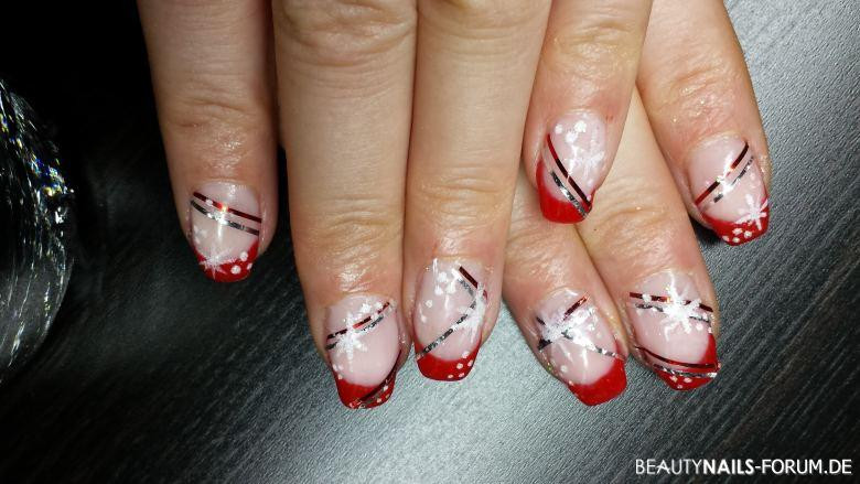 Nageldesign Winter Bilder
 Winter Nageldesign mit Sternen und rotem French Winter