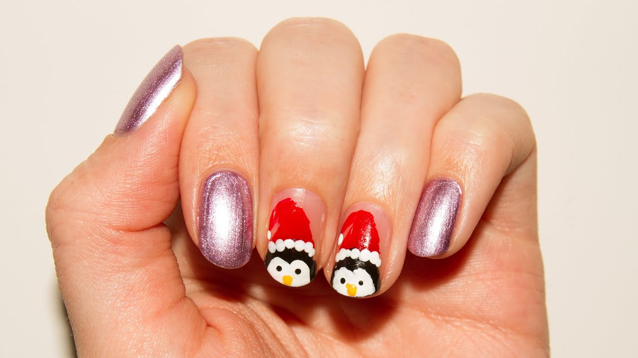Nageldesign Mit Glitzerpulver
 Winter Nageldesign Pinguine mit Weihnachtsmützen