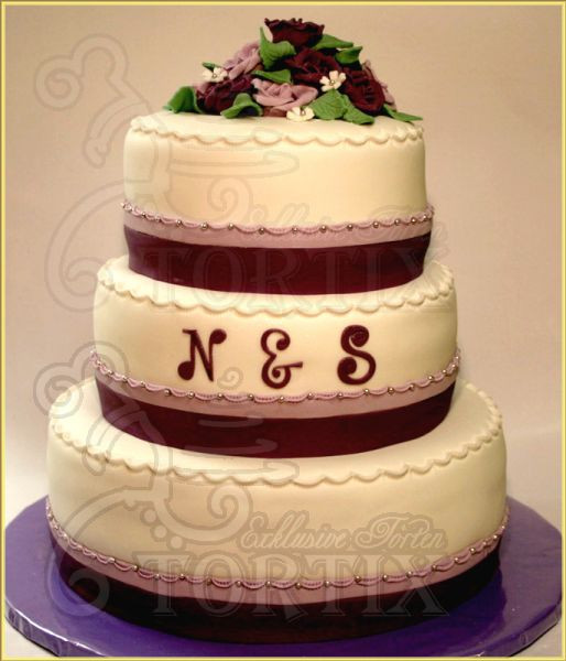 Hochzeitstorte 3 Stöckig
 Tortix Hochzeitstorte 3 stöckig mit lila Rosen